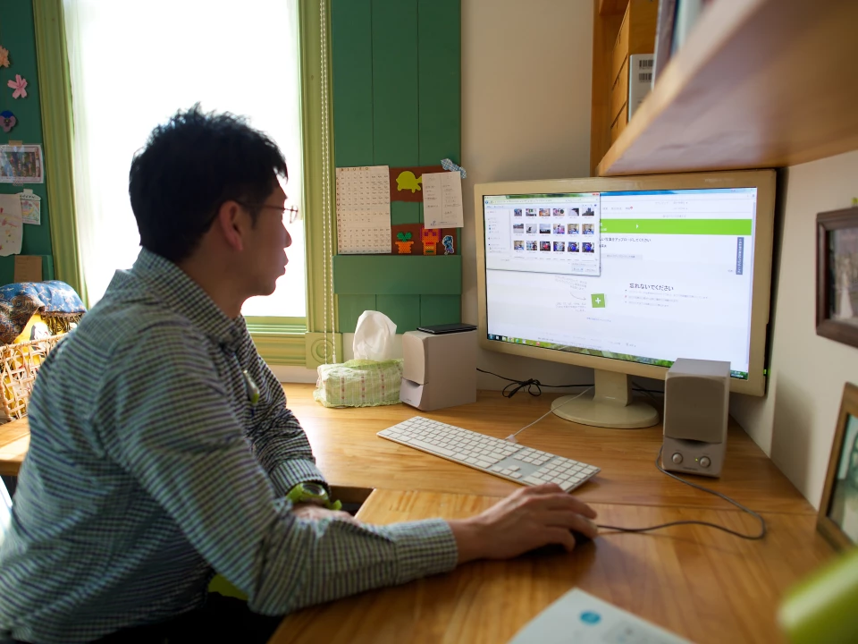 A man works at a computer
